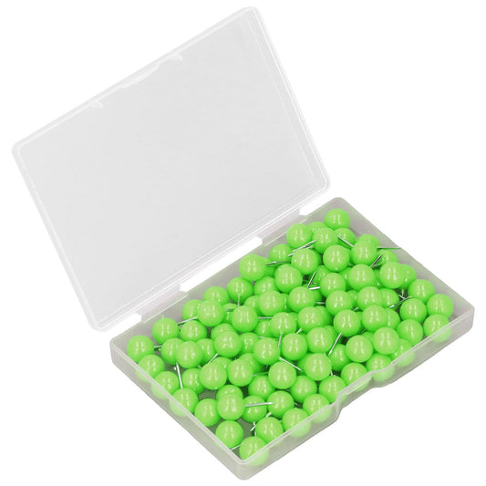 Green push pins in a clear plastic case with lid open, metal point visible