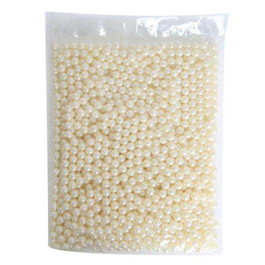 Packet of white pearl beads in clear plastic bag