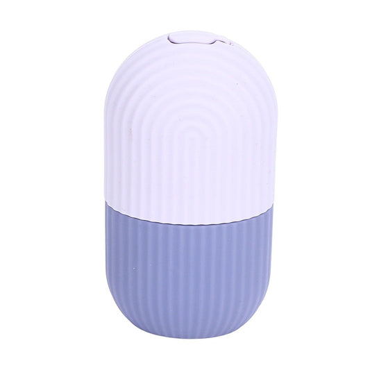 Silicone ice face mold cylinder with ridged grip, light purple top and purple bottom