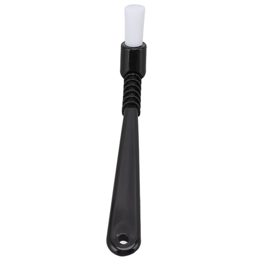Coffee machine cleaning brush with white nylon bristle end and black handle