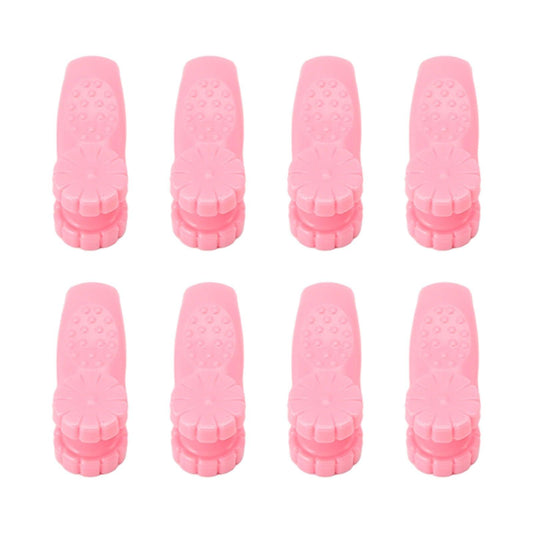Set of 8 pink plastic acupressure hand clips with textured pads, front view