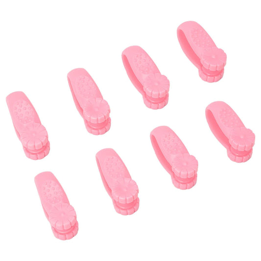 Set of 8 pink plastic acupressure hand clips, angled side view
