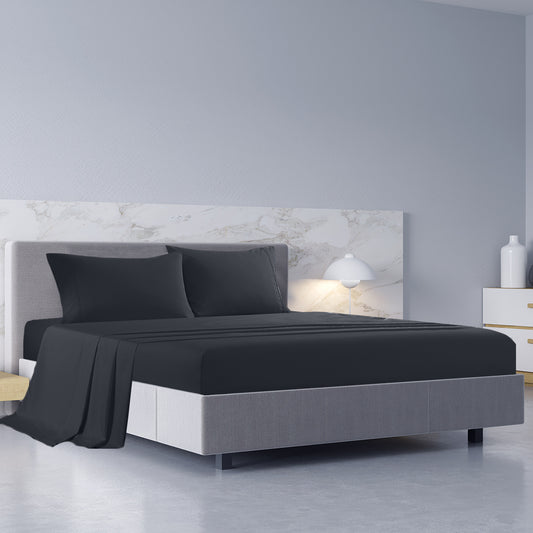 Charcoal sheet set on king bed with two matching pillowcases