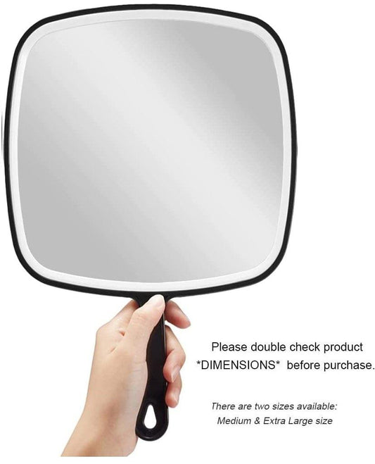 Black handheld mirror with rounded square frame and short handle, held in hand