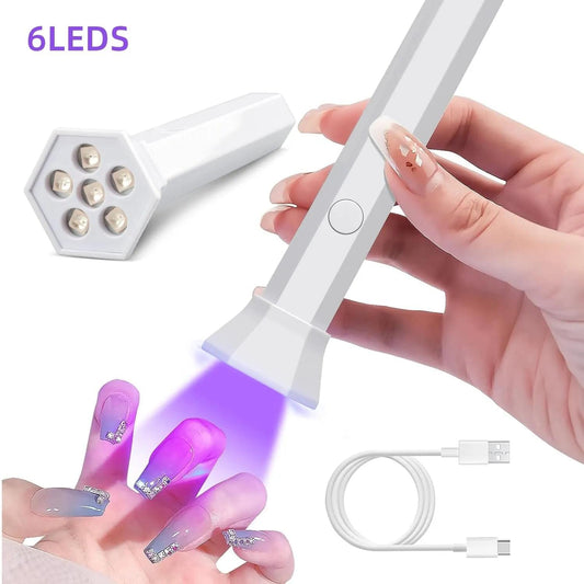 Handheld UV LED nail dryer lamp with angled base and circular LED lens tray