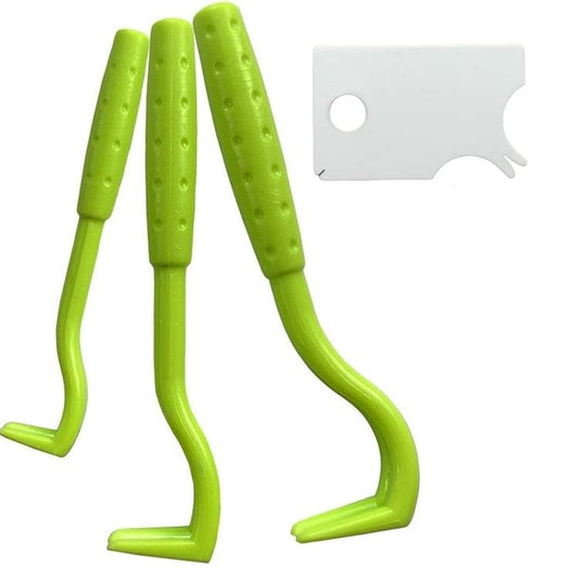 Green tick remover tool pair with curved prongs and white instruction card