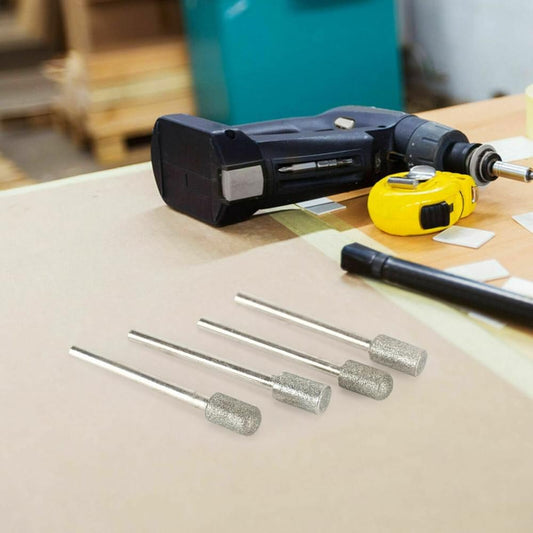 Diamond grinding burr bits with 3mm shanks beside a rotary tool