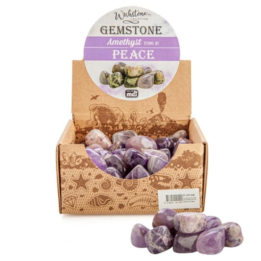 Tumbled amethyst gemstones in a display box with loose stones