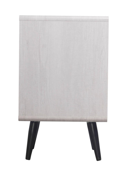 Three-drawer cabinet side panel in light gray wood with black tapered legs