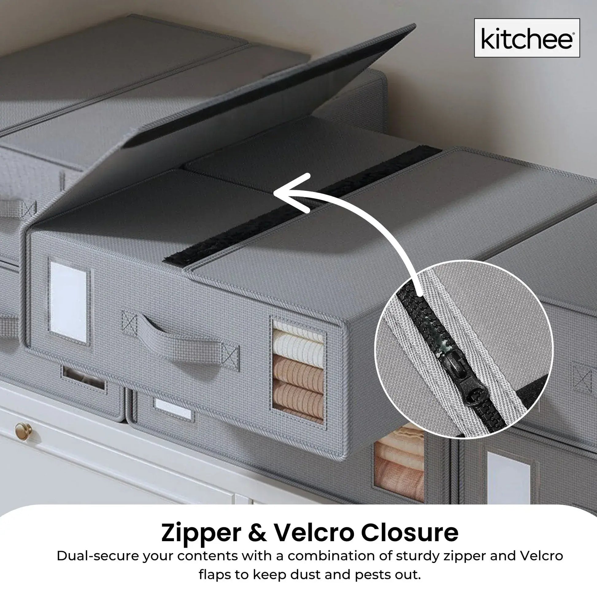 Grey storage box with lid open, showing internal compartments and front viewing window