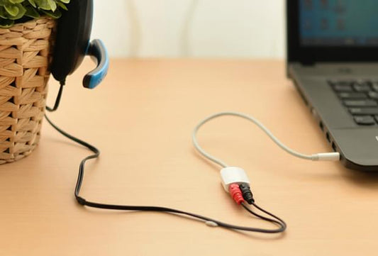 UGREEN 3.5mm headset splitter cable connected to headphone jack, white