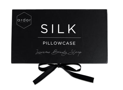 Silk pillowcase gift box in black with ribbon bow and brand lettering