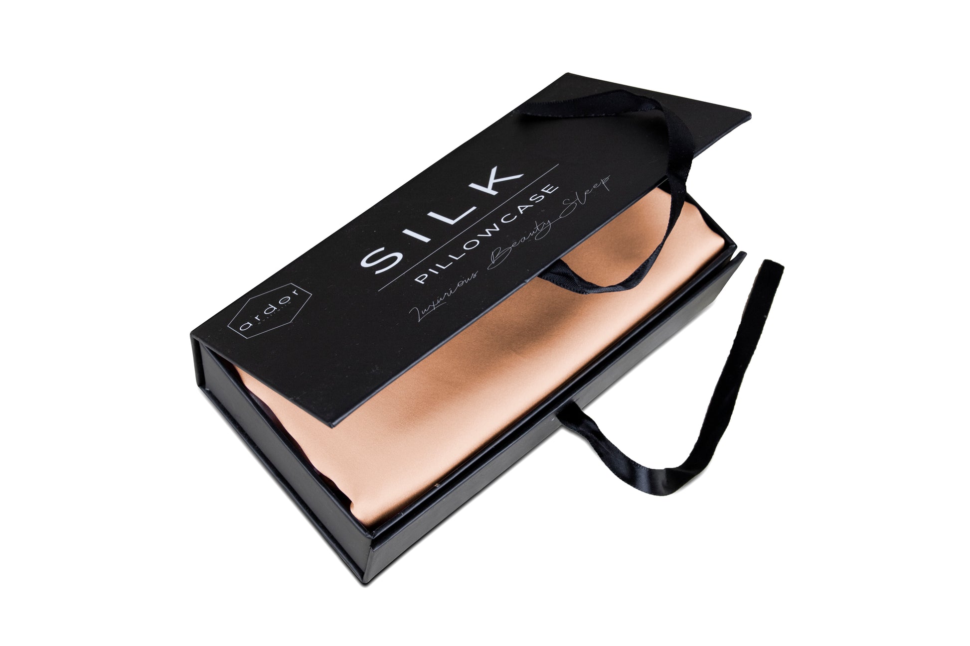 Peach silk pillowcase in box with folded fabric and black ribbon ties