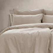 King quilt cover set with light beige, washed cotton-style bedding and matching pillowcases