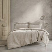 King quilt cover set in light beige with coordinated pillowcases and gathered bed skirt