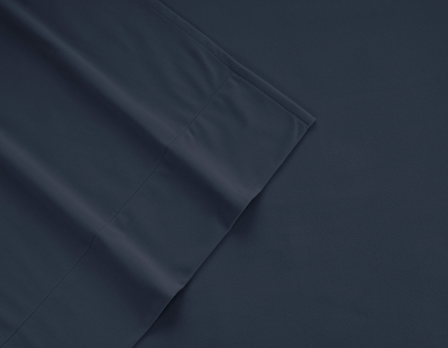 Navy micro flannel sheet fabric close-up with stitched seam detail