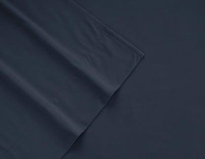 Navy micro flannel sheet fabric close-up with stitched seam detail