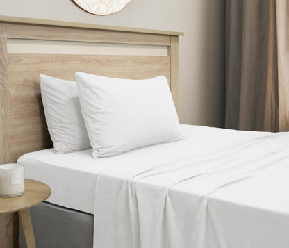 Micro flannel sheet set on single bed with two white pillowcases and flat sheet