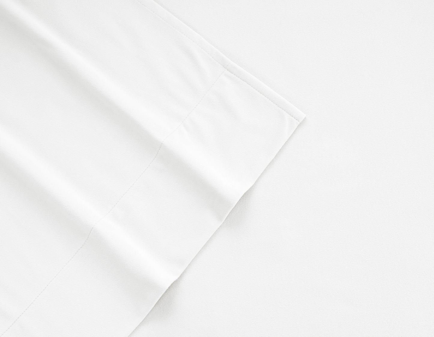 White flannel sheet corner with stitched seam and folded edge detail