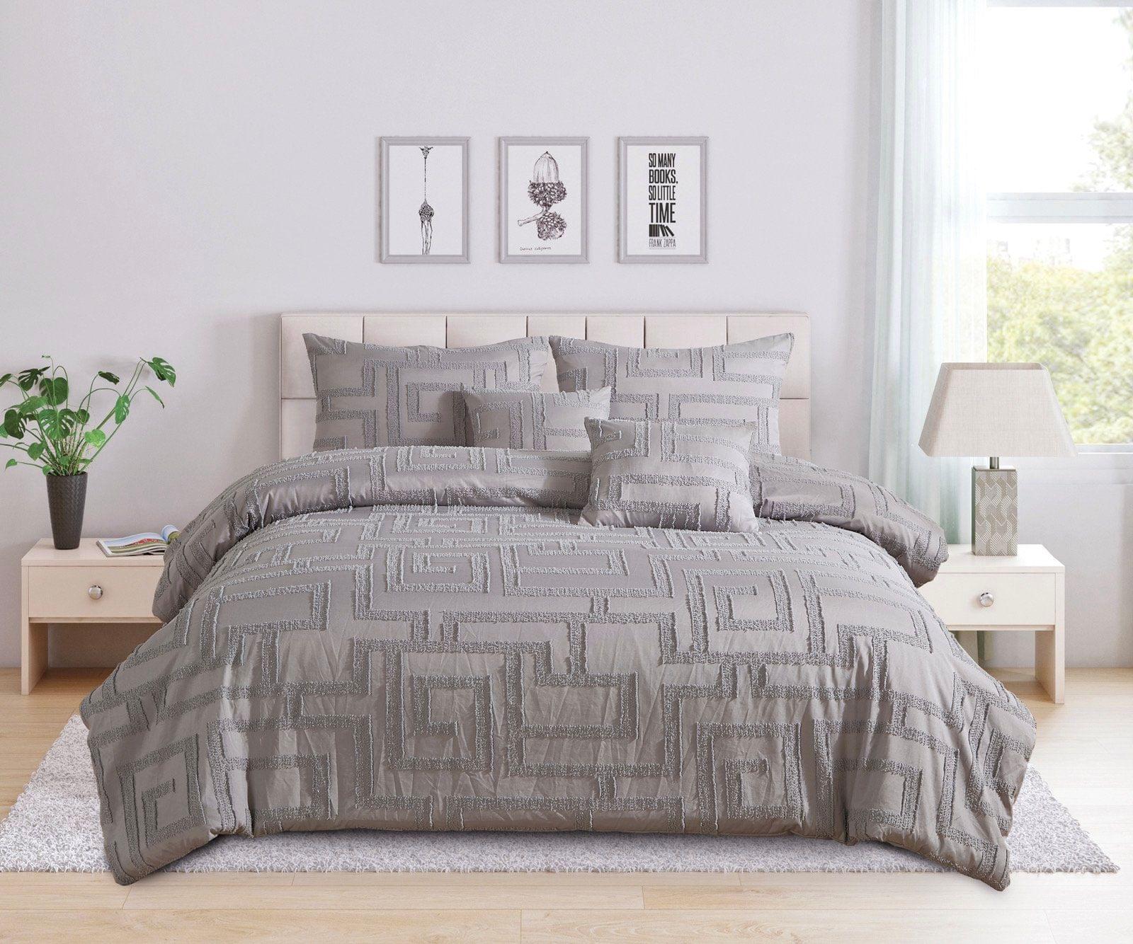 Queen-size grey jacquard bedding set with patterned quilt, pillows, and shams