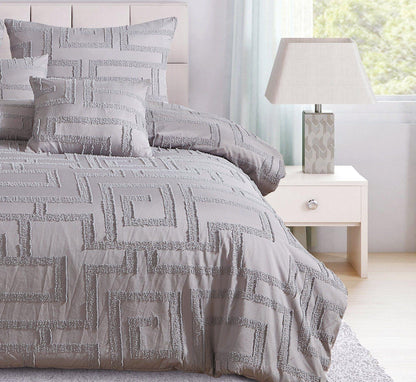 Grey jacquard duvet cover with raised geometric squares and coordinating pillow shams