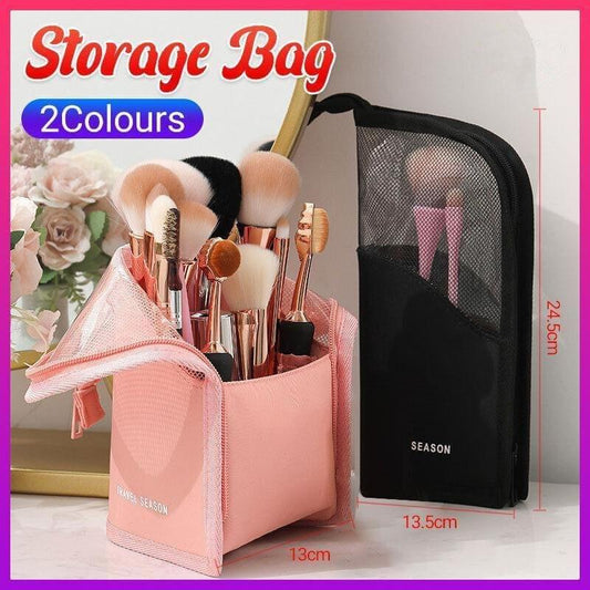 Pink makeup brush organizer bag with open mesh compartment and zip closure