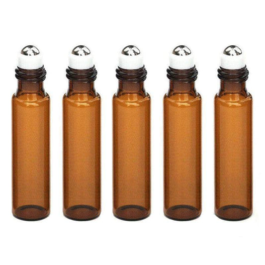 Set of five amber glass perfume oil bottles with silver roll-on caps