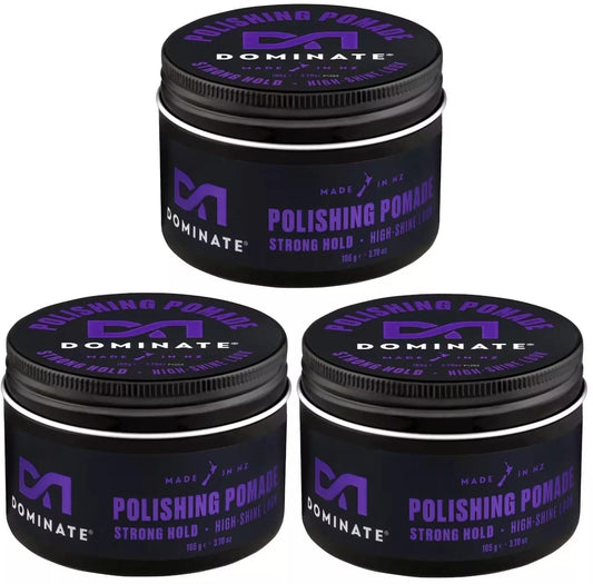 Three black hair pomade jars with purple Domininate branding and black screw lids.