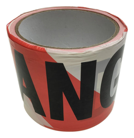 Red and white danger warning tape roll with black DANGER lettering on dispenser