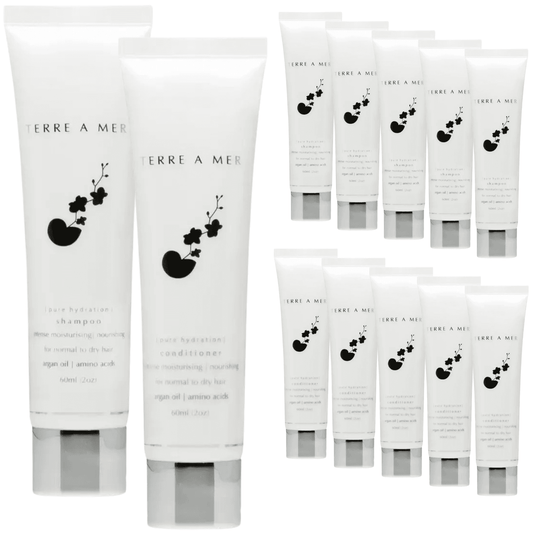 Assorted Terre a Mer hair care tubes in white packaging, travel-size set