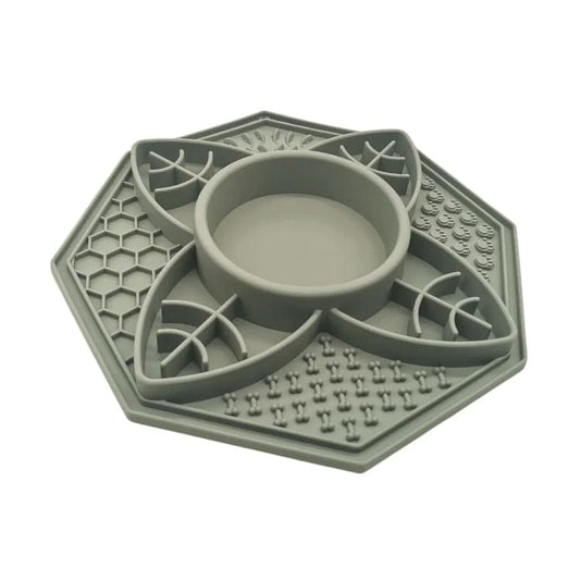 Sage green slow feeder lick mat with raised maze pattern and center bowl