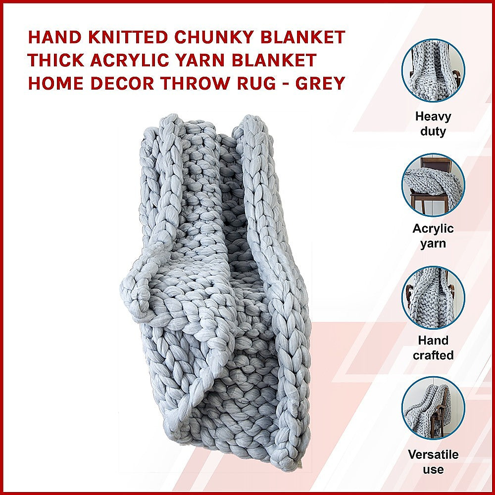 Chunky knit blanket in light grey, thick braided loops with folded drape