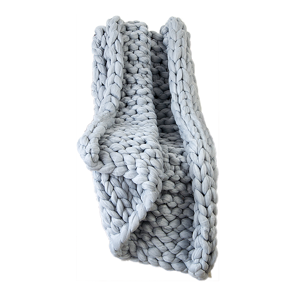 Chunky knit acrylic blanket in light grey, thick braided loops and folded edge