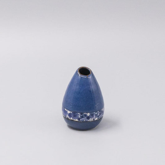 Small indigo ceramic vase with floral band at the base and rounded shape