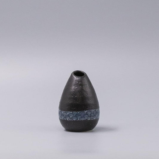 Black ceramic vase with blue wave band and narrow opening, pinecone-shaped form
