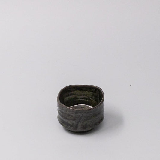 Sake cup with dark moss-black glaze and textured ceramic body