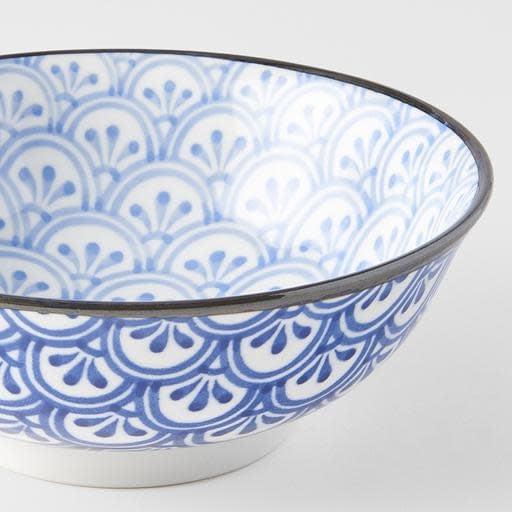Ceramic bowl with blue petal crest pattern and dark rim, white interior