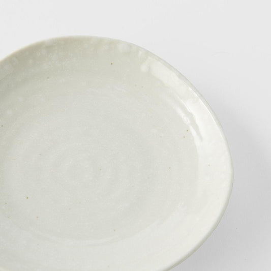 Round ceramic saucer with soft white glossy glaze, shallow wide rim