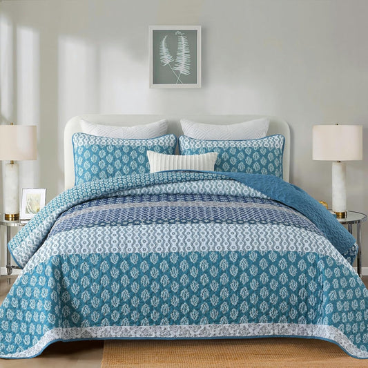 Quilted bedspread set in blue with mixed geometric and floral medallion patterns