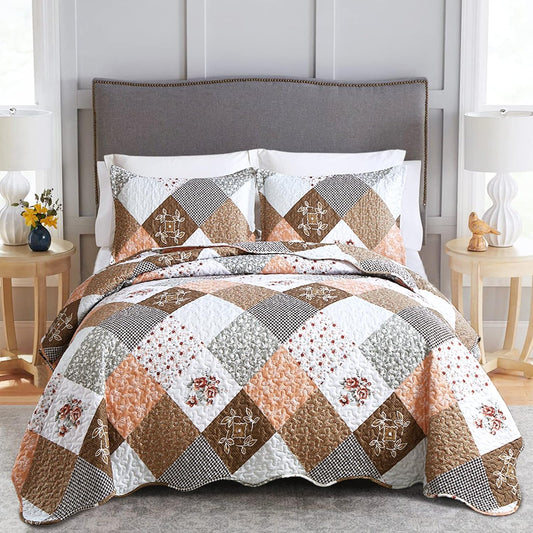 Patchwork quilt bedspread with rust brown, white, gray and tan diamond blocks