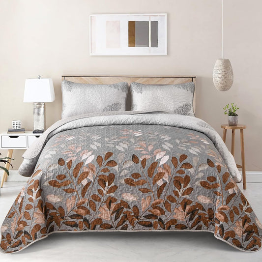 Grey botanical bedspread with rust leaf floral pattern and matching pillow shams