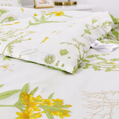 Floral pillow cover corner in white with green leaves and small yellow flowers