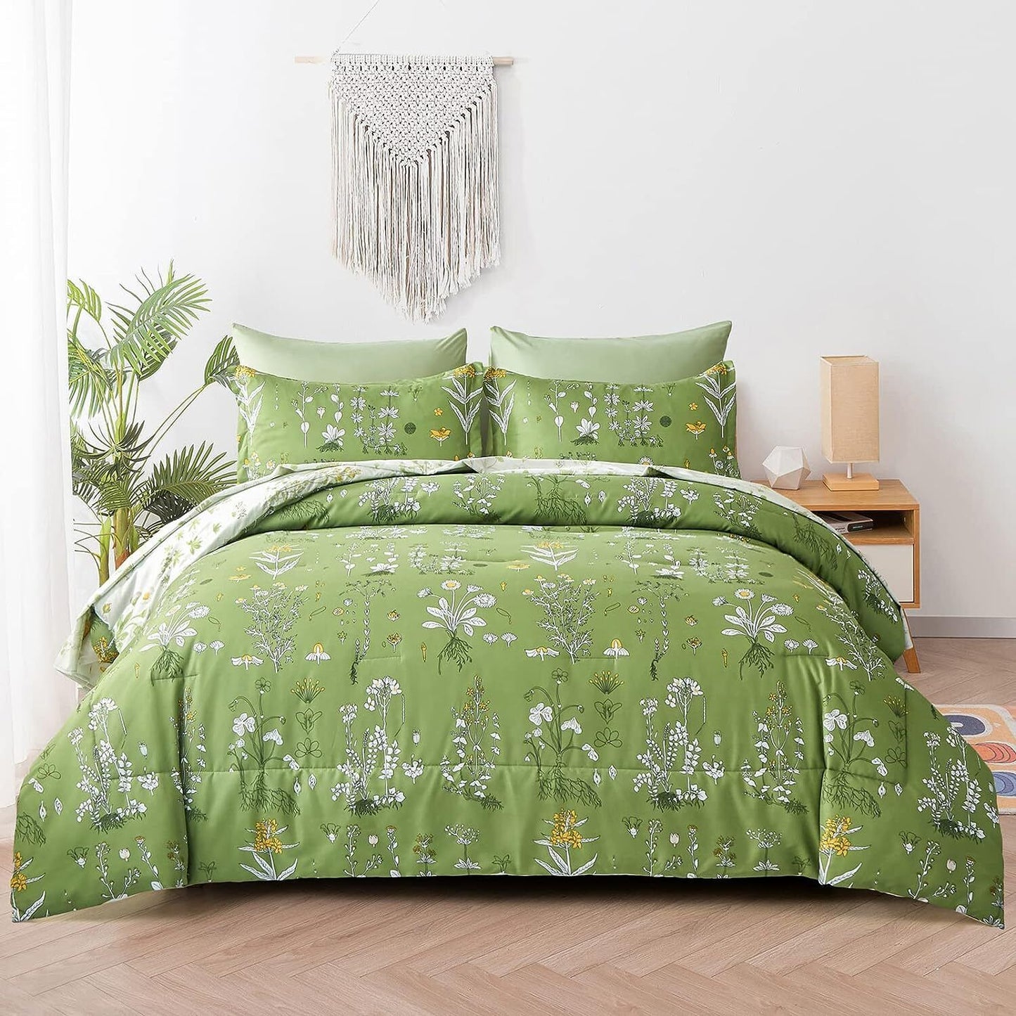 Green floral comforter set with matching pillow covers, shown folded on a bed