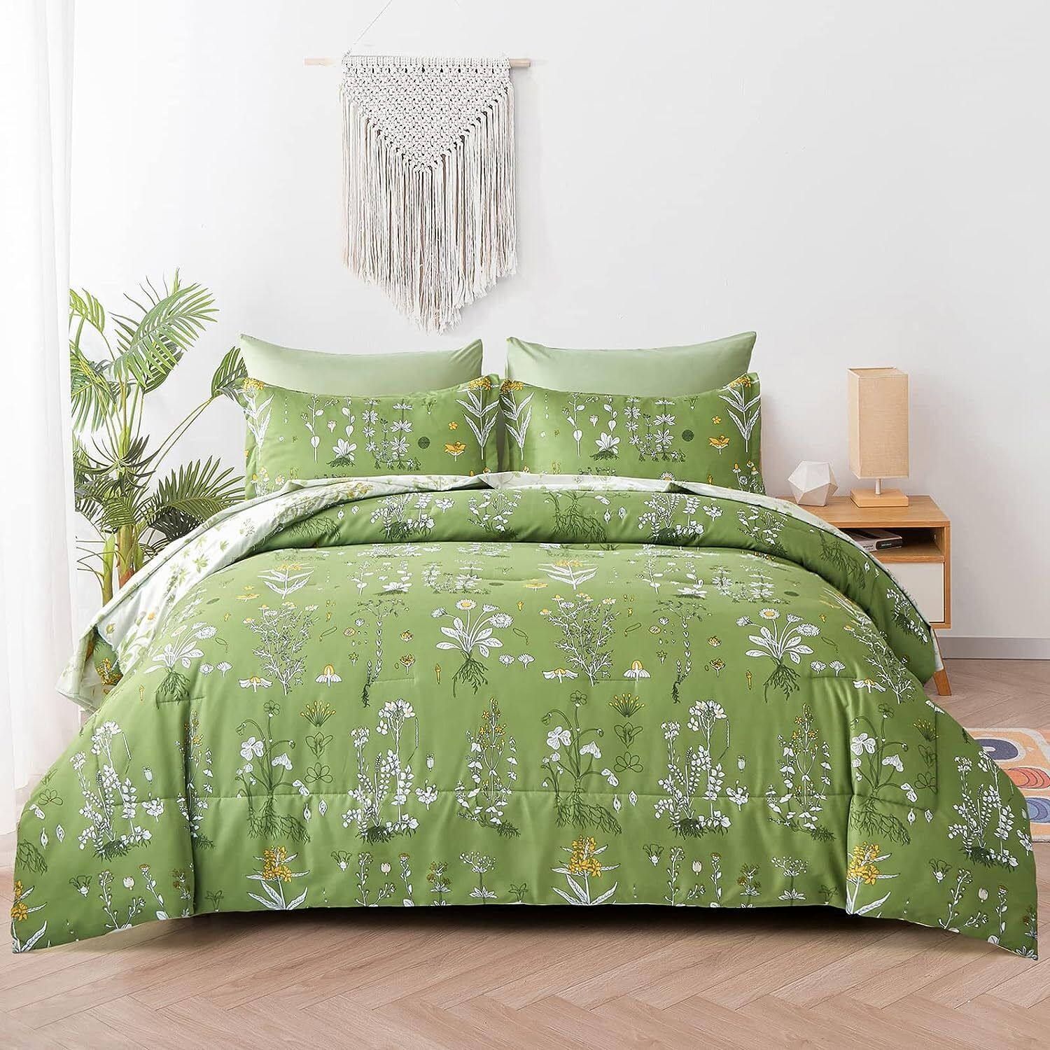 Green floral comforter set with matching pillow covers, shown folded on a bed