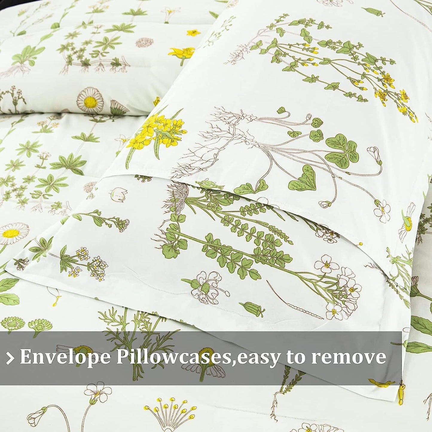 White comforter with green and yellow botanical vine pattern, folded top