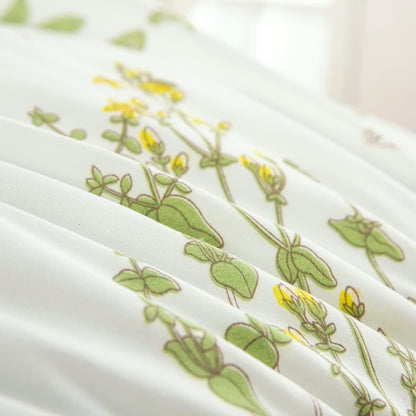 White bedding fabric with green leaf and yellow flower line pattern