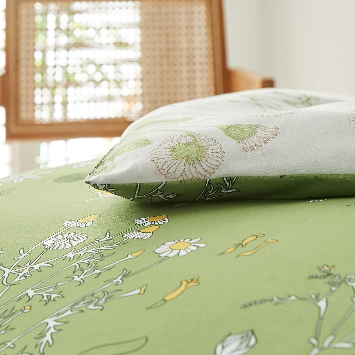 Green comforter with white floral outlines and matching pillow cover