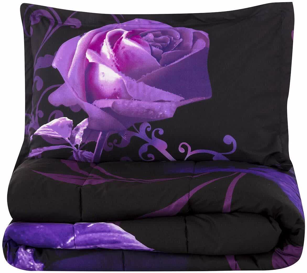 Comforter set and pillow: black with purple rose print, folded view