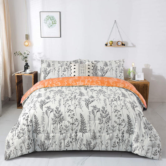 Reversible comforter with white botanical pattern and orange top border
