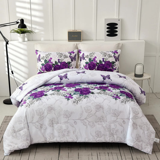 Quilted comforter set on bed with purple rose and butterfly prints on white